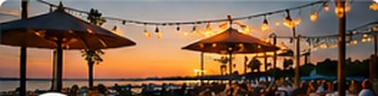 Patio dining under string lights at sunset